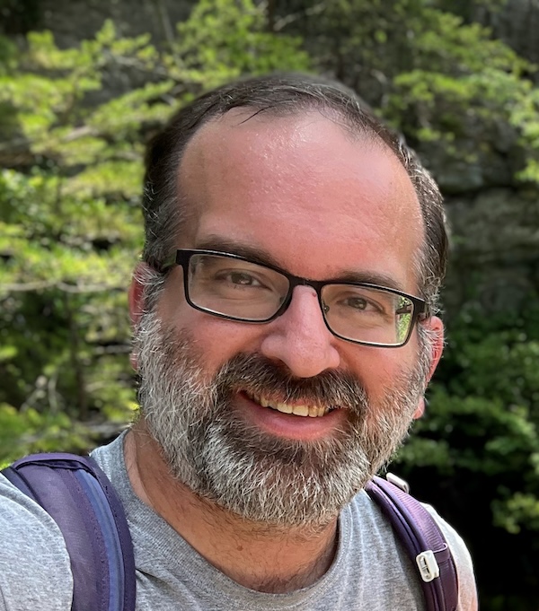 Headshot of Jeremy, hiking in the NC mountains